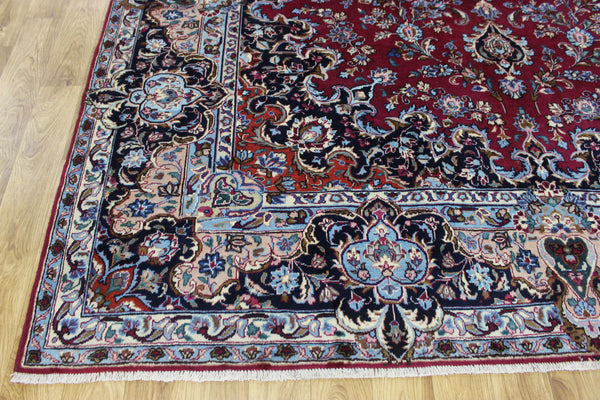 SIGNED PERSIAN KERMAN RUG WITH A FINE FLORAL DESIGN 325 X 225 CM