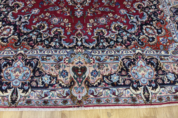 SIGNED PERSIAN KERMAN RUG WITH A FINE FLORAL DESIGN 325 X 225 CM