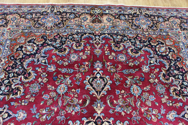 SIGNED PERSIAN KERMAN RUG WITH A FINE FLORAL DESIGN 325 X 225 CM