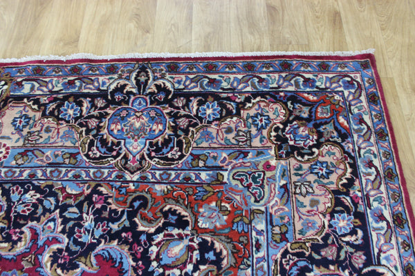 SIGNED PERSIAN KERMAN RUG WITH A FINE FLORAL DESIGN 325 X 225 CM