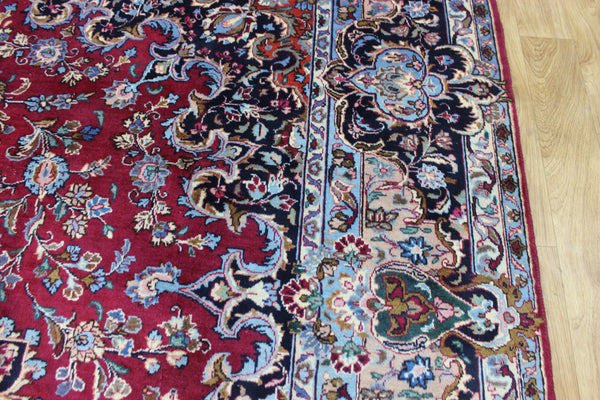 SIGNED PERSIAN KERMAN RUG WITH A FINE FLORAL DESIGN 325 X 225 CM