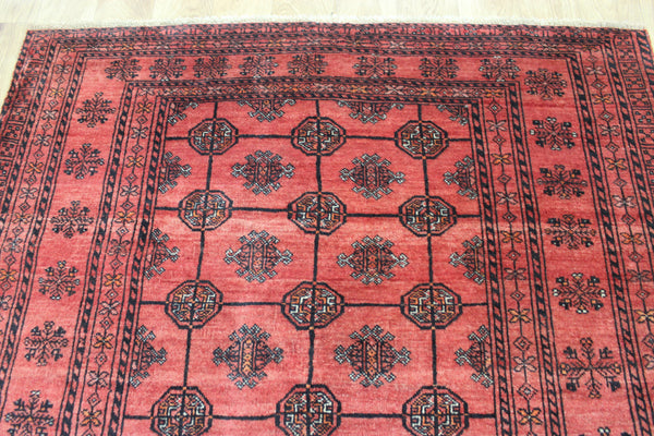 Vintage handmade Turkmen wool rug of traditional gul design 190 x 127 cm