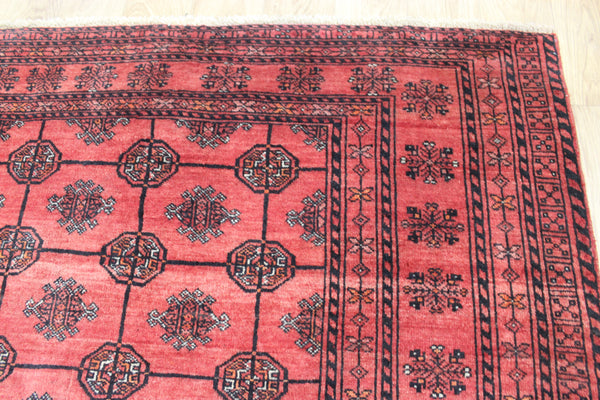 Vintage handmade Turkmen wool rug of traditional gul design 190 x 127 cm