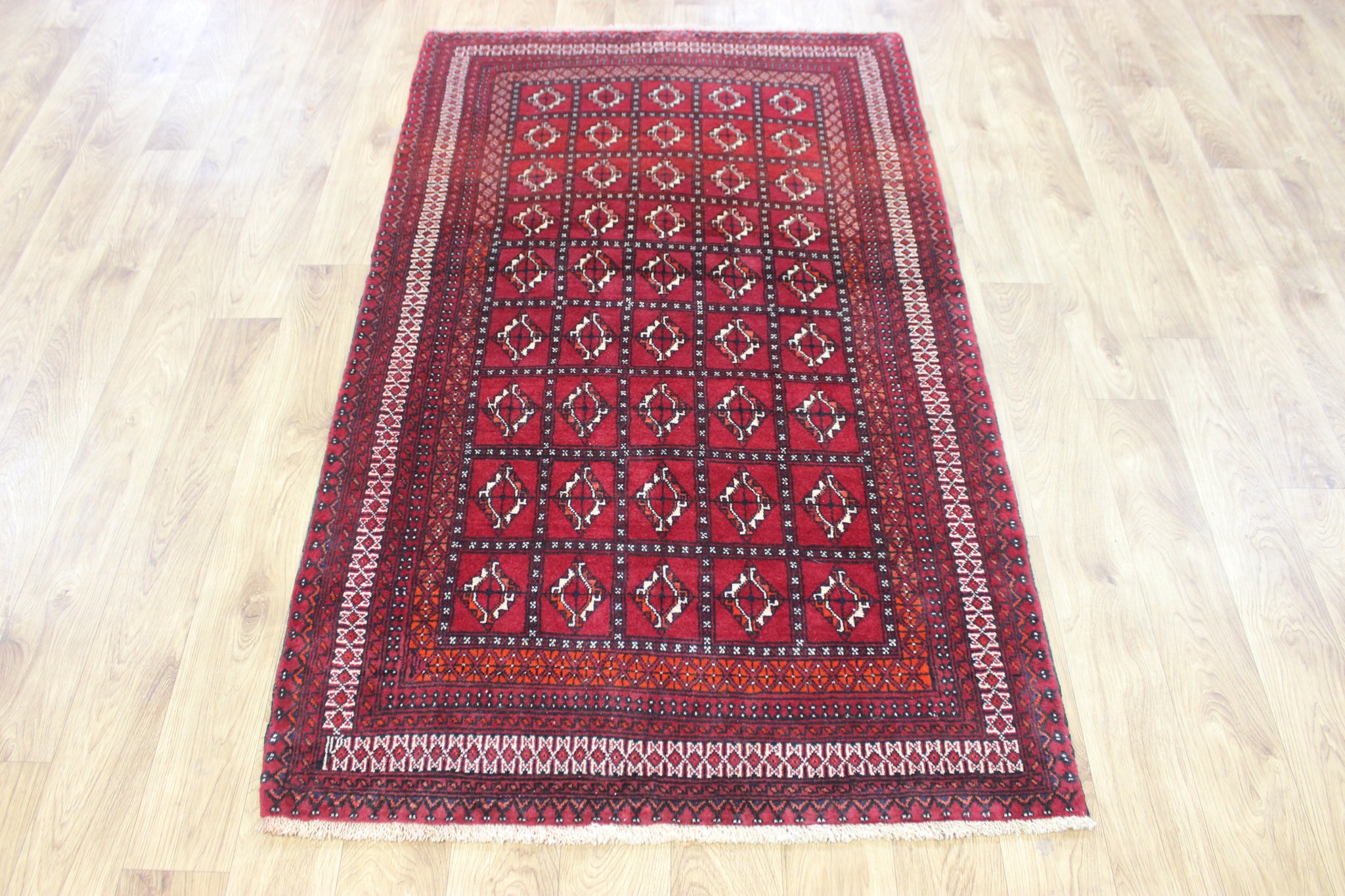 Fine handmade Persian Turkmen wool rug of traditional gul design 165 x 100 cm