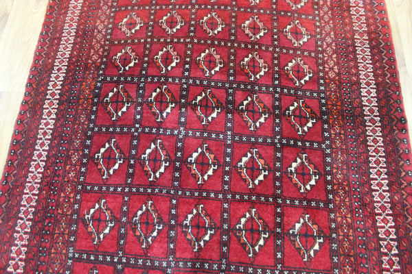 Fine handmade Persian Turkmen wool rug of traditional gul design 165 x 100 cm