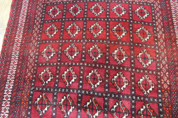 Fine handmade Persian Turkmen wool rug of traditional gul design 165 x 100 cm