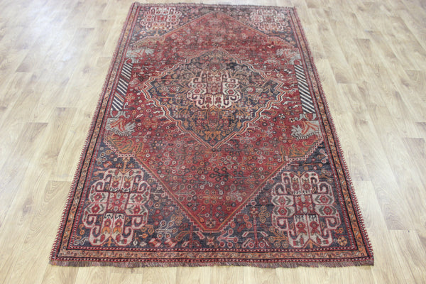 Antique Persian Qashqai rug with a large medallion design 215 x 130 cm