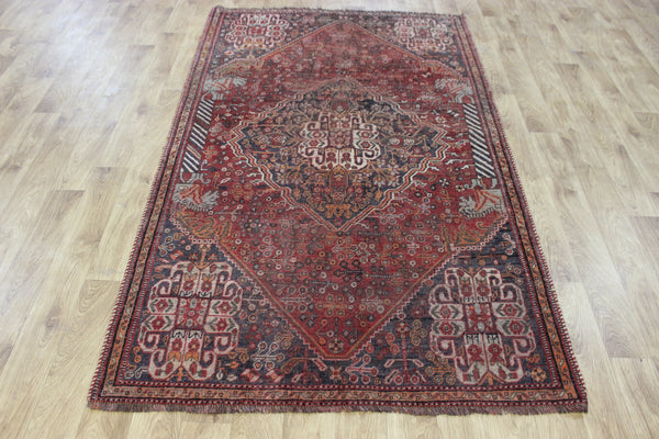 Antique Persian Qashqai rug with a large medallion design 215 x 130 cm