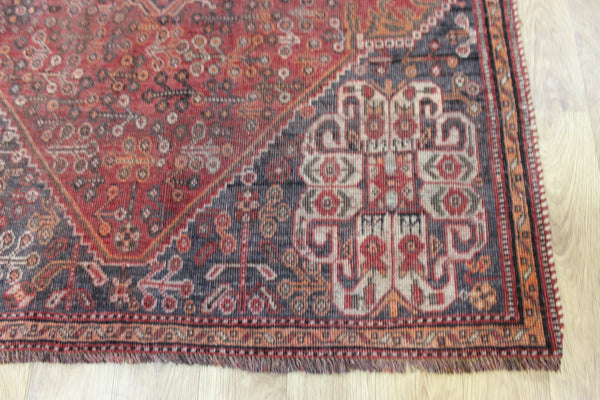 Antique Persian Qashqai rug with a large medallion design 215 x 130 cm