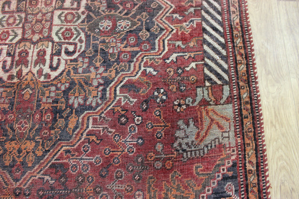 Antique Persian Qashqai rug with a large medallion design 215 x 130 cm