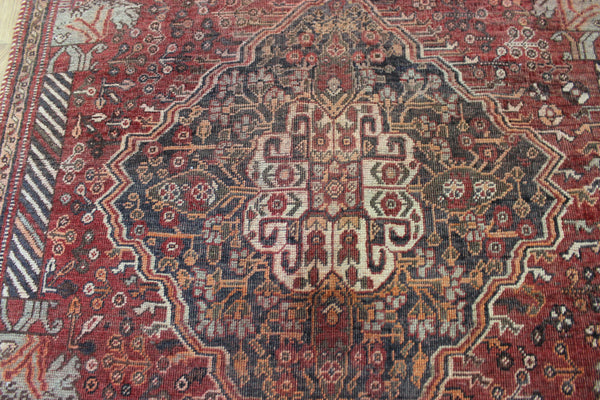 Antique Persian Qashqai rug with a large medallion design 215 x 130 cm