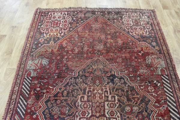 Antique Persian Qashqai rug with a large medallion design 215 x 130 cm