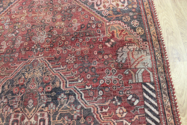 Antique Persian Qashqai rug with a large medallion design 215 x 130 cm