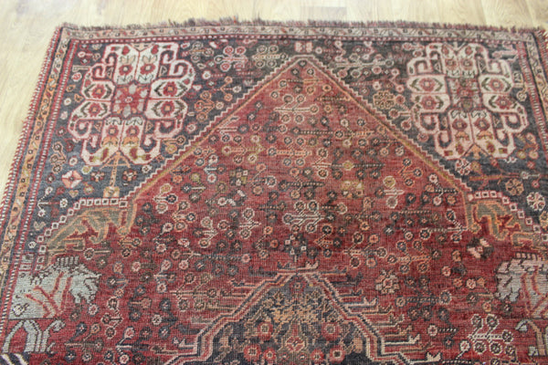 Antique Persian Qashqai rug with a large medallion design 215 x 130 cm