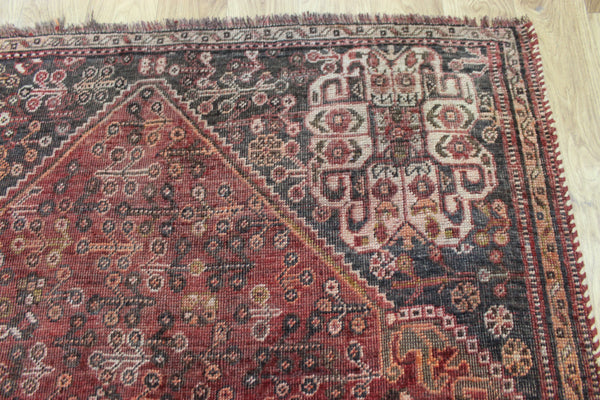 Antique Persian Qashqai rug with a large medallion design 215 x 130 cm