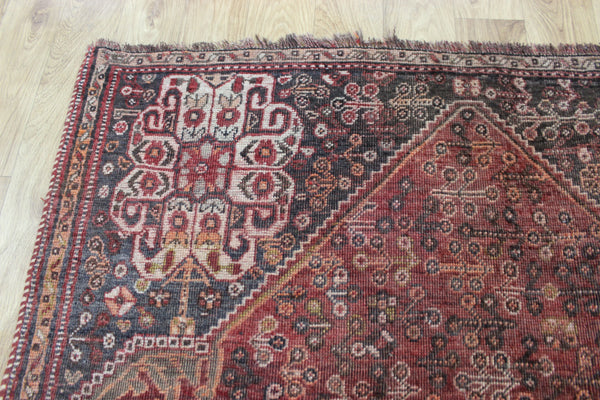 Antique Persian Qashqai rug with a large medallion design 215 x 130 cm