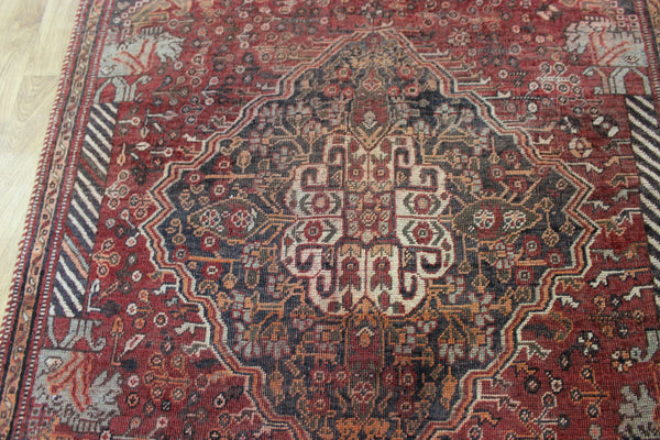 Antique Persian Qashqai rug with a large medallion design 215 x 130 cm