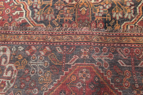 Antique Persian Qashqai rug with a large medallion design 215 x 130 cm