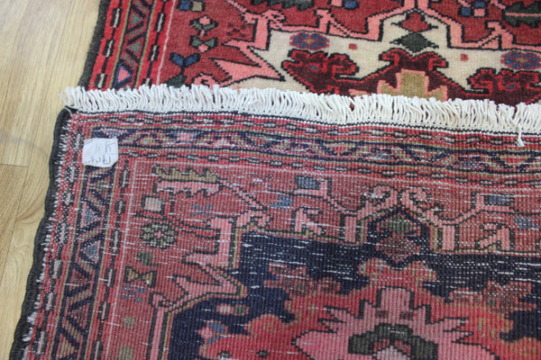An outstanding handmade Persian Heriz runner of traditional medallion design 280 x 80 cm