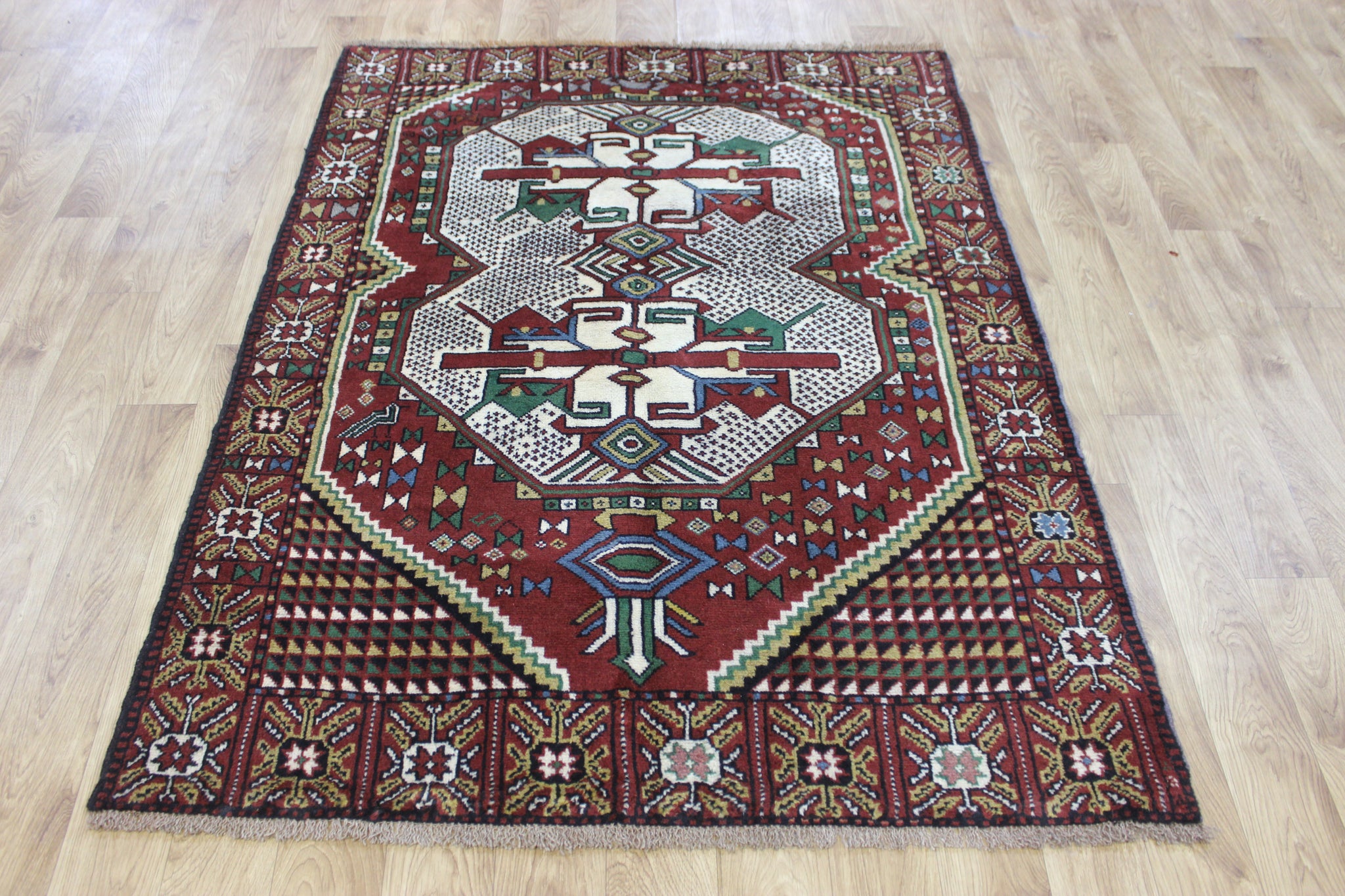 Fine handmade Persian Goochan rug of traditional medallion design