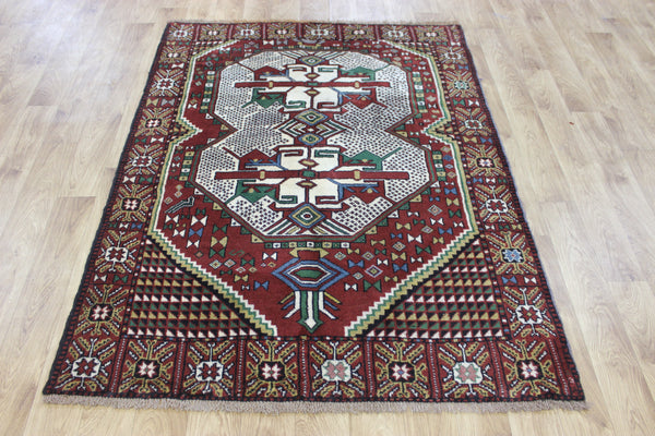 Fine handmade Persian Goochan rug of traditional medallion design