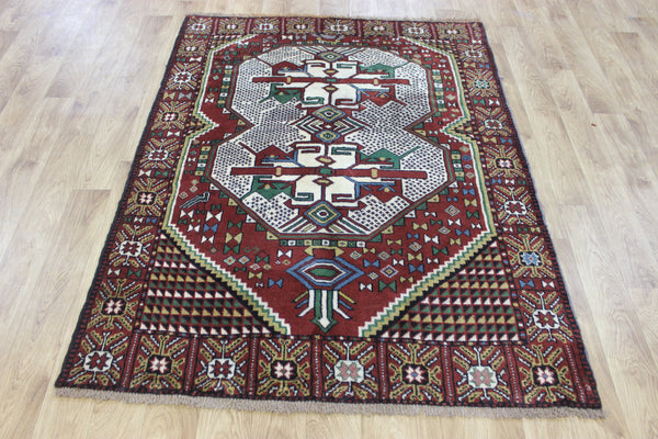 Fine handmade Persian Goochan rug of traditional medallion design