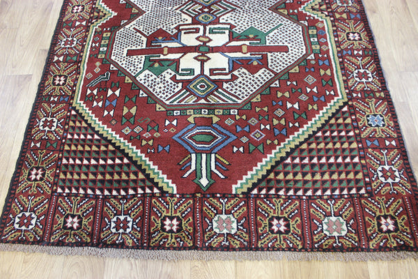 Fine handmade Persian Goochan rug of traditional medallion design