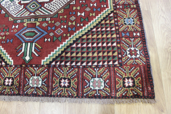 Fine handmade Persian Goochan rug of traditional medallion design