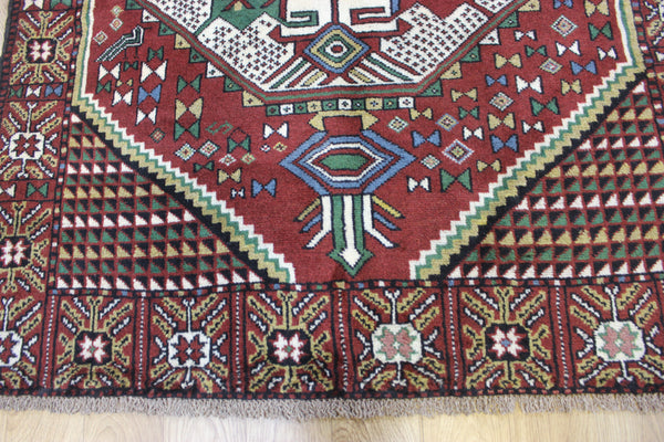 Fine handmade Persian Goochan rug of traditional medallion design