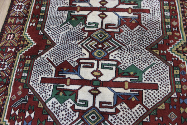 Fine handmade Persian Goochan rug of traditional medallion design