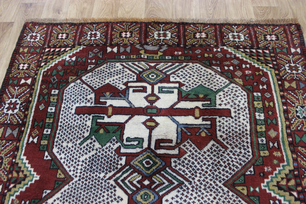Fine handmade Persian Goochan rug of traditional medallion design