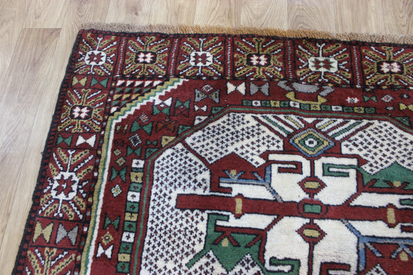 Fine handmade Persian Goochan rug of traditional medallion design