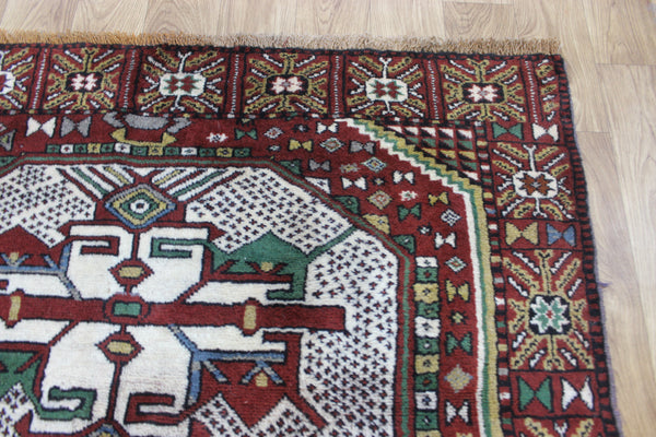Fine handmade Persian Goochan rug of traditional medallion design