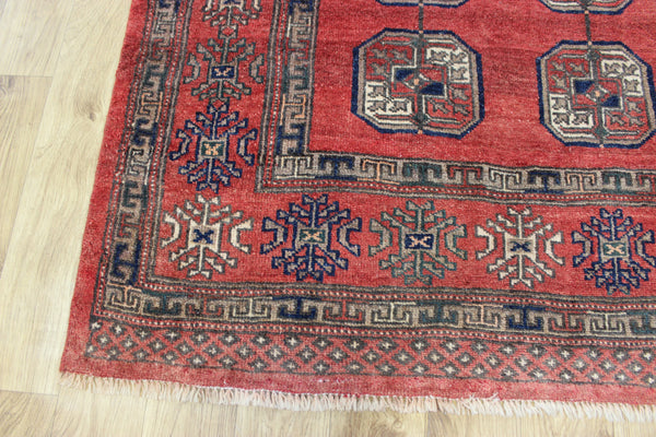 Vintage handmade Turkmen wool rug of traditional large gul design 217 x 126 cm