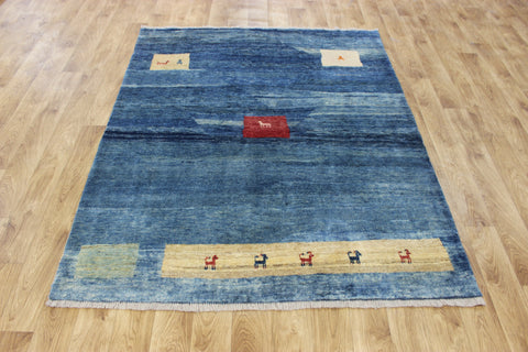 Vintage handmade Persian Gabbeh wool rug with tribal design elements 180 x 145 cm