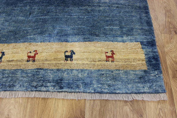 Vintage handmade Persian Gabbeh wool rug with tribal design elements 180 x 145 cm