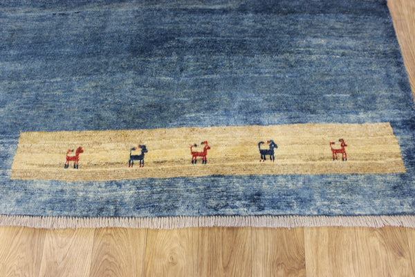 Vintage handmade Persian Gabbeh wool rug with tribal design elements 180 x 145 cm