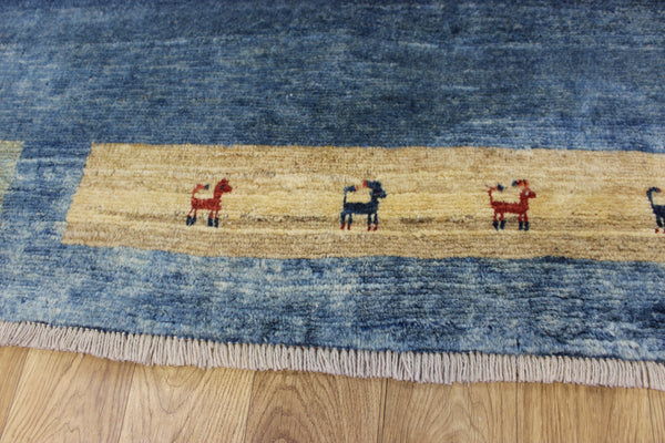 Vintage handmade Persian Gabbeh wool rug with tribal design elements 180 x 145 cm