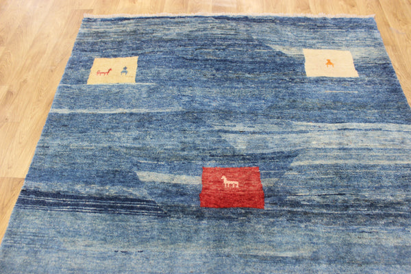 Vintage handmade Persian Gabbeh wool rug with tribal design elements 180 x 145 cm