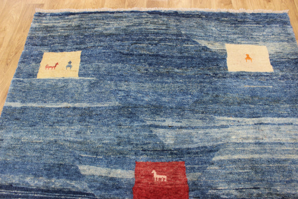 Vintage handmade Persian Gabbeh wool rug with tribal design elements 180 x 145 cm