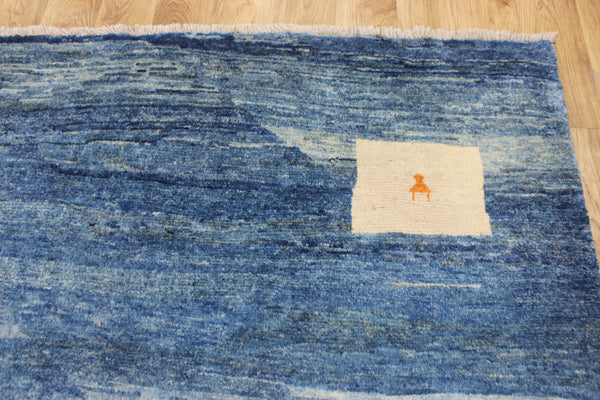 Vintage handmade Persian Gabbeh wool rug with tribal design elements 180 x 145 cm