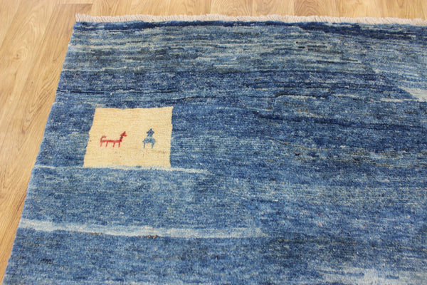 Vintage handmade Persian Gabbeh wool rug with tribal design elements 180 x 145 cm