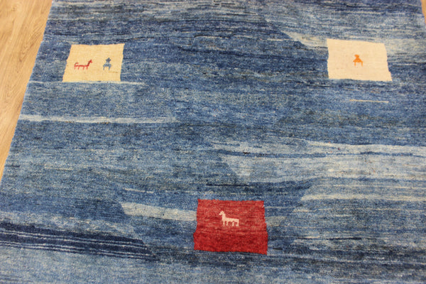 Vintage handmade Persian Gabbeh wool rug with tribal design elements 180 x 145 cm