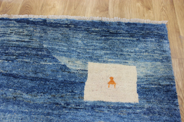 Vintage handmade Persian Gabbeh wool rug with tribal design elements 180 x 145 cm