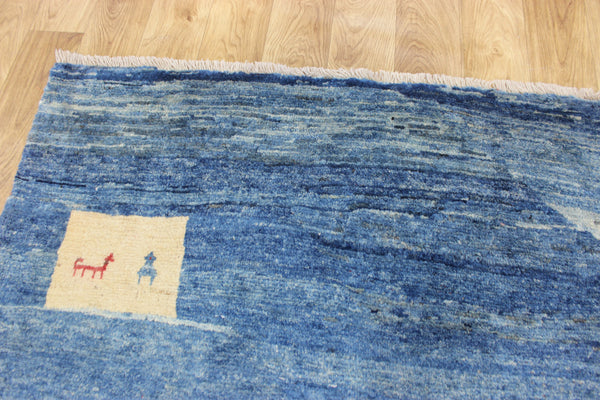 Vintage handmade Persian Gabbeh wool rug with tribal design elements 180 x 145 cm