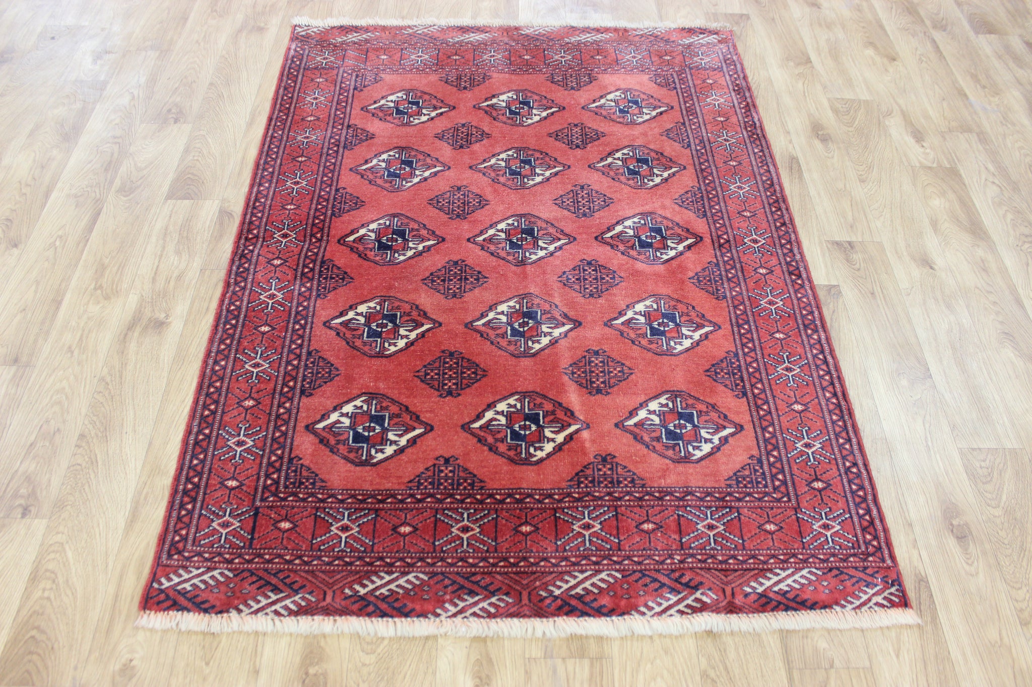 Vintage handmade Bokhara Turkmen wool rug of traditional large gul design 157 x 115 cm