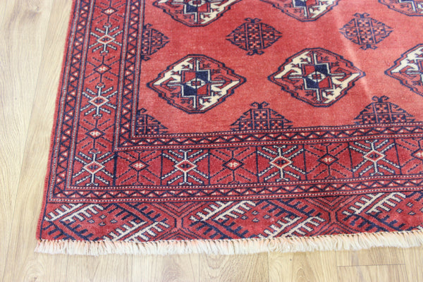 Vintage handmade Bokhara Turkmen wool rug of traditional large gul design 157 x 115 cm