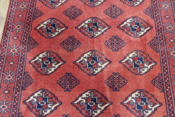 Vintage handmade Bokhara Turkmen wool rug of traditional large gul design 157 x 115 cm