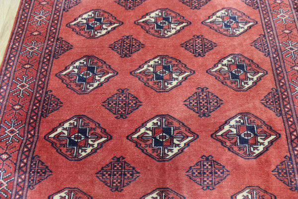 Vintage handmade Bokhara Turkmen wool rug of traditional large gul design 157 x 115 cm