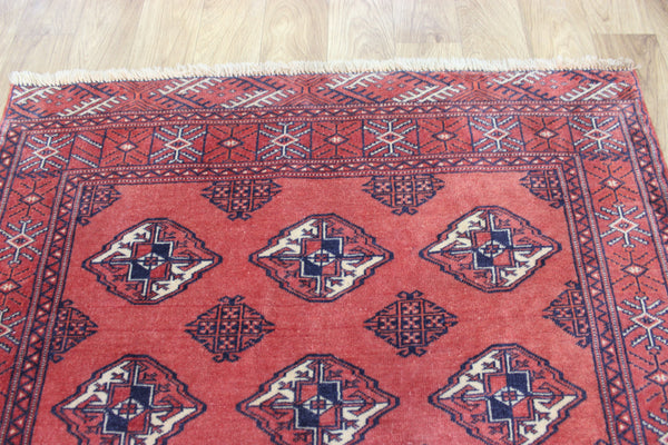 Vintage handmade Bokhara Turkmen wool rug of traditional large gul design 157 x 115 cm